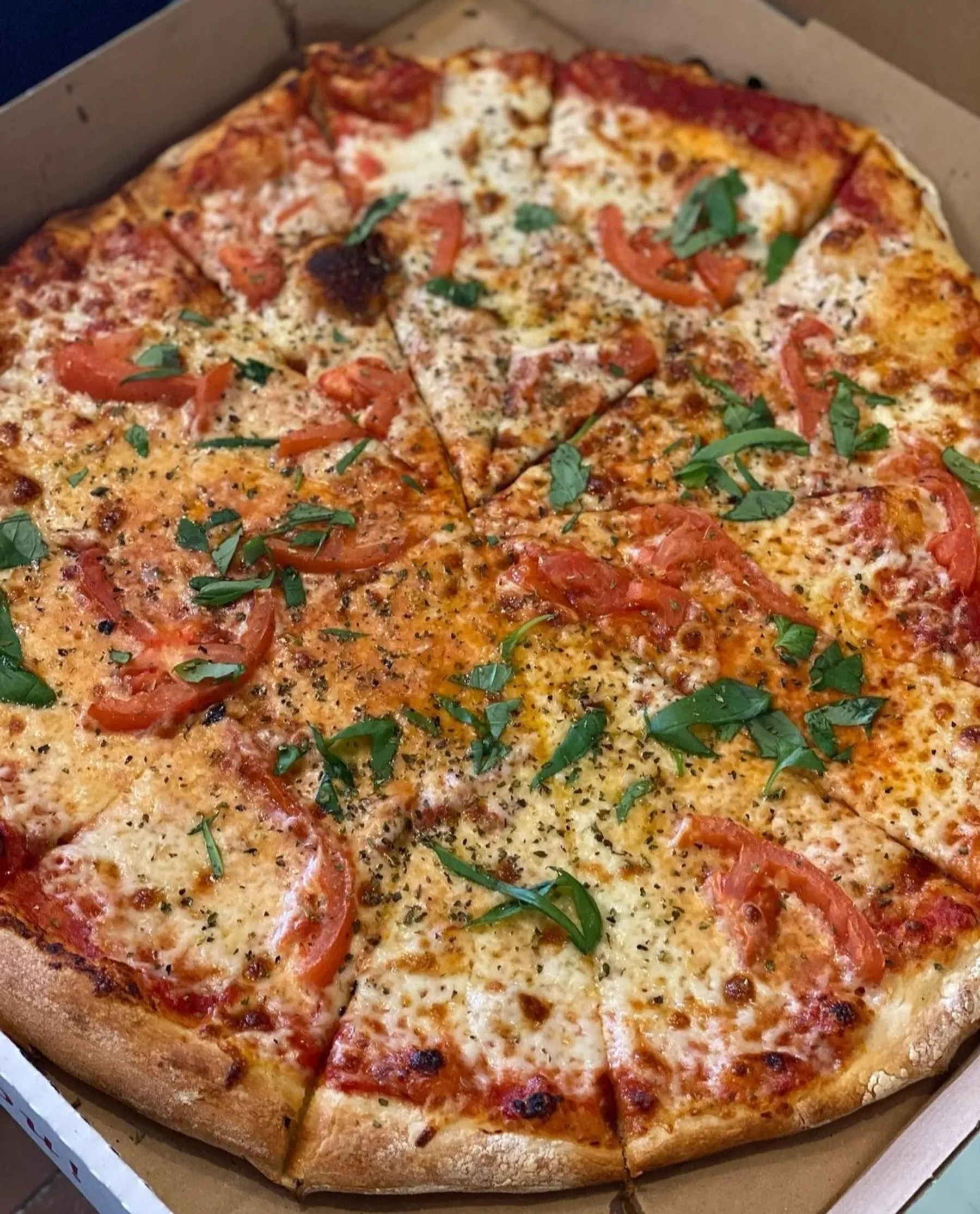 A close look at Gino's thin, round pizza
